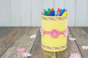 Painted can with floral tape and flowers