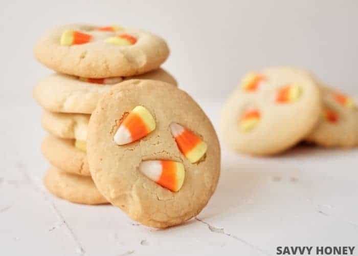 sugar cookies baked with candy corn candy pieces in the middle