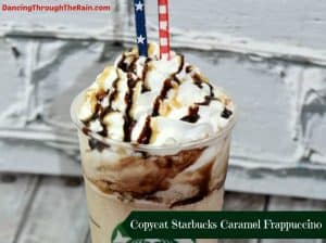 caramel frappuccino drink in plastic up with whipped topping and chocolate syrup drizzle on top