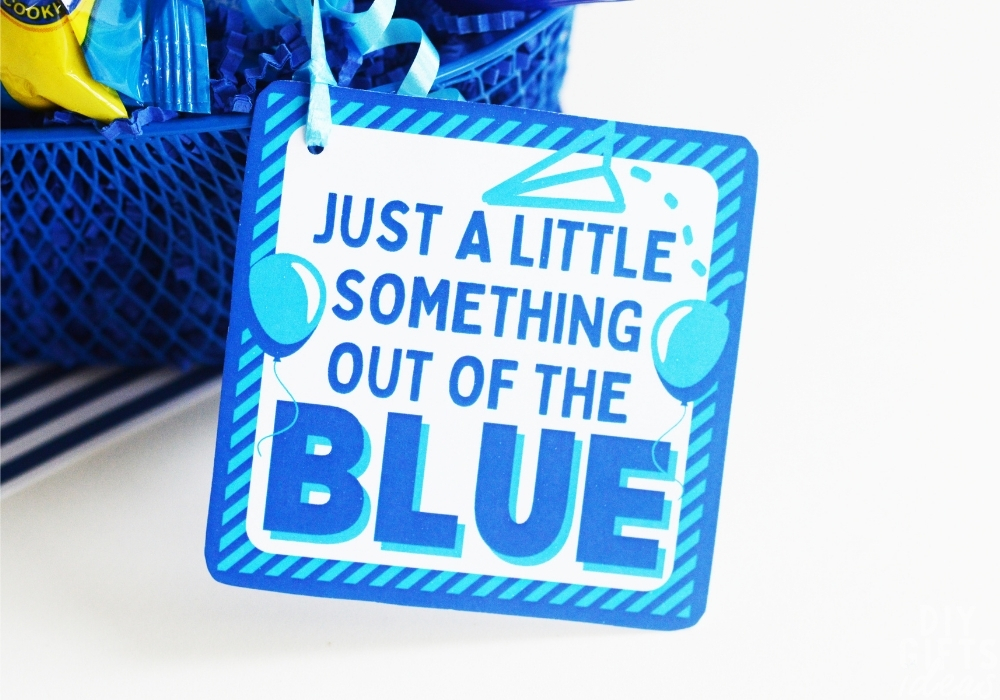 Close up of a printable tag that says "Just a little something out of the blue".