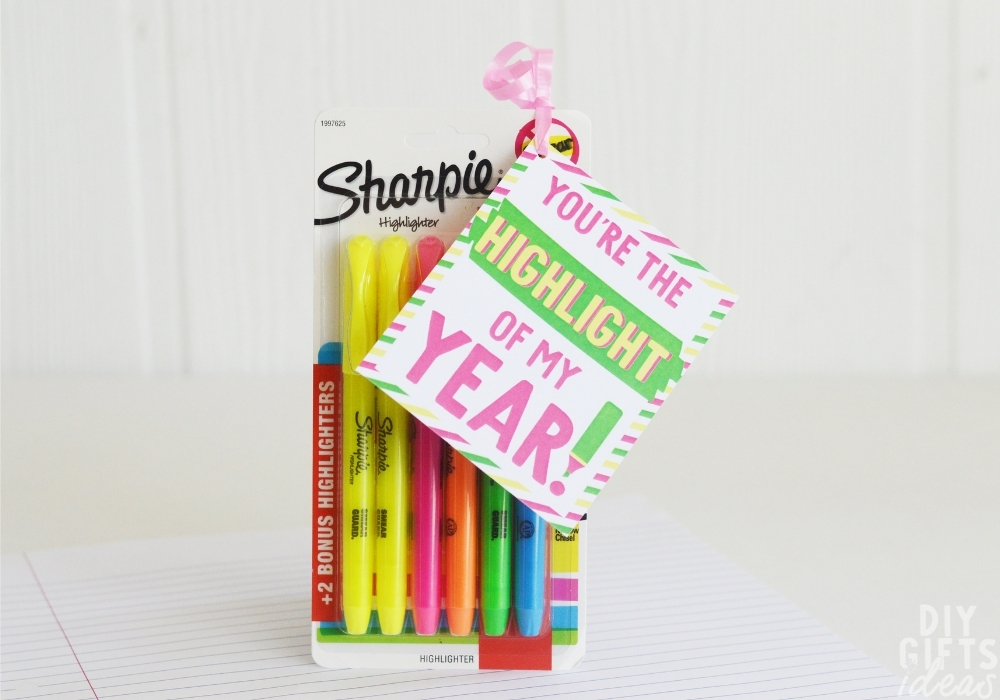The completed DIY Highlighter Teacher Gift sitting on top of a piece of notebook paper.
