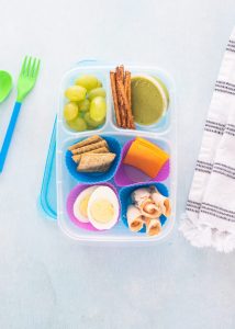 plastic meal prep container with small snacks to make lunchables