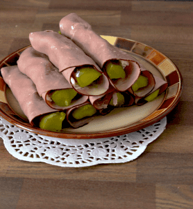 sliced lunch meat around pickle slices