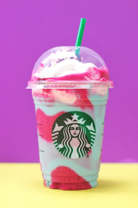 pink and light blue frappuccino in starbucks cup with green straw