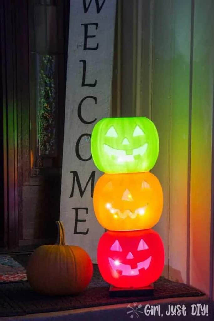 DIY Halloween Porch Ideas with plastic pumpkins and lights inside