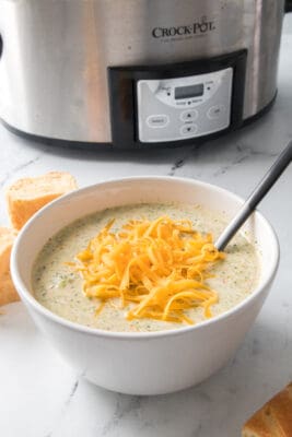Bowl of broccoli cheddar soup with a crock pot