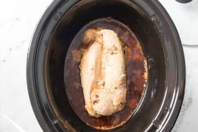 Cooked pork in a slow cooker