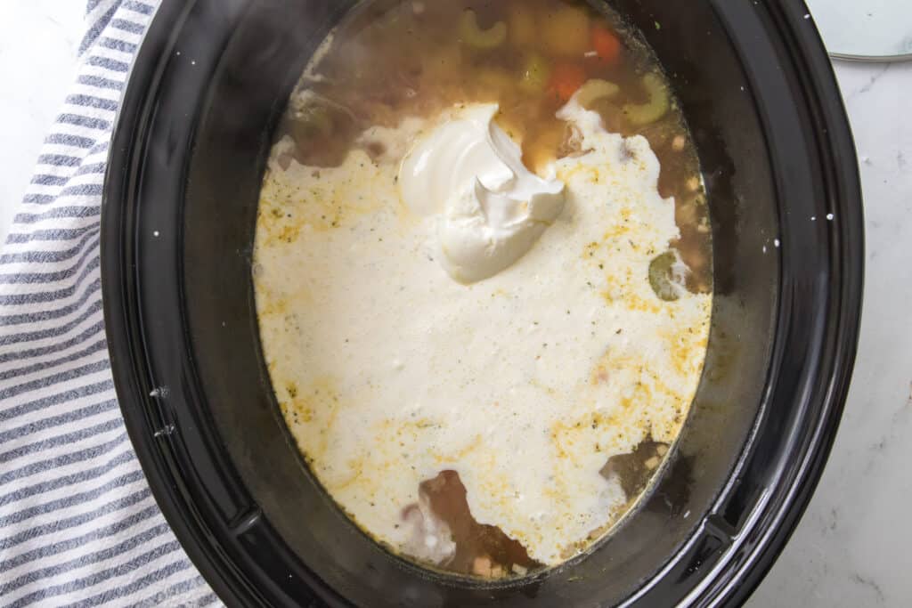 cornstarch slurry and sour cream added to potato soup in the slow cooker