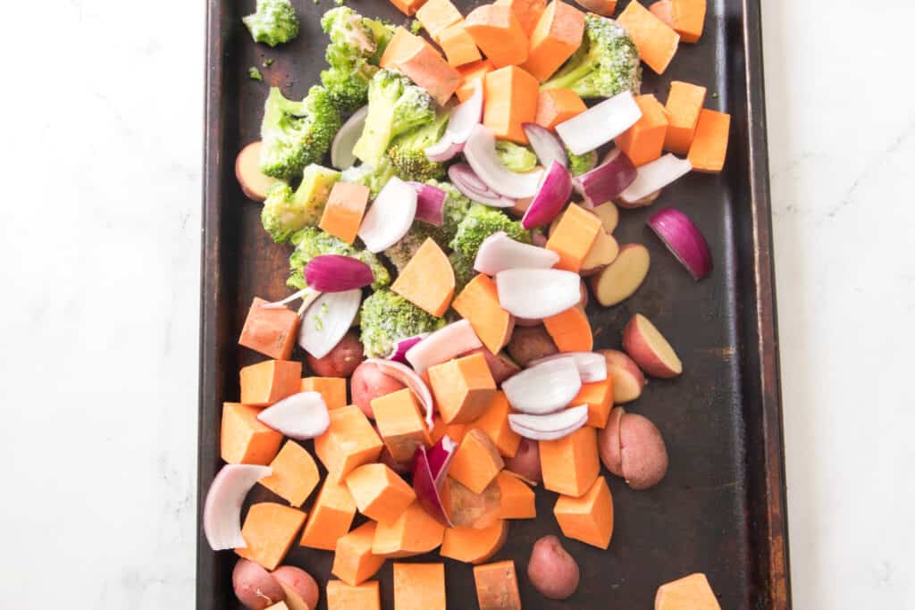 sweet potatoes, red potatoes, red onion, frozen broccoli on sheet pan