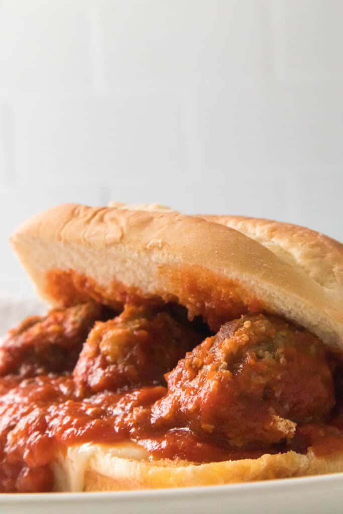 meatball sub on white plate