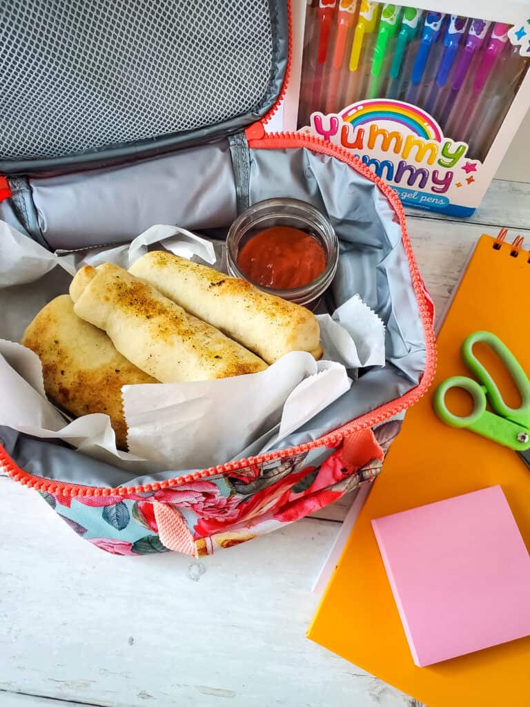 Pizza dippers packed in a lunch box.